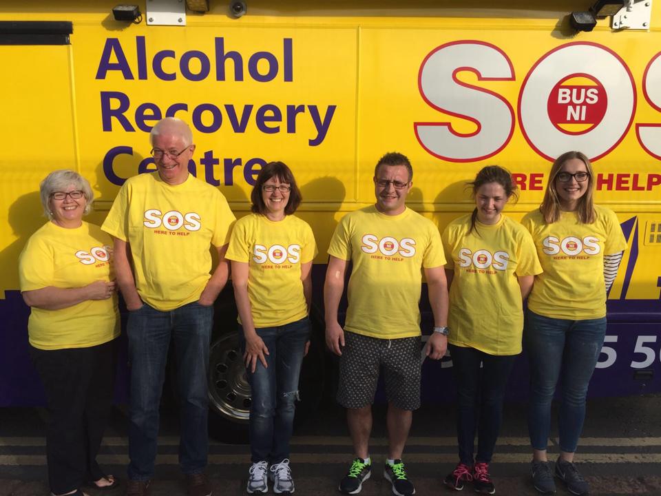 SOS Bus NI volunteers in front of the bus